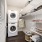 Luxury Apartments in Eagan, MN with In-Unit Washer and Dryer - Viking Lakes Residences - Well-Lit Laundry Room with Stacked Washer and Dryer, Cream-Colored Walls, and Wall-Mounted Storage Shelves for Laundry Essentials.