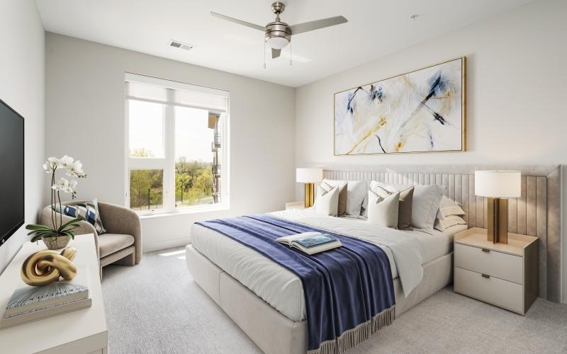 large windows brighten carpeted bedroom