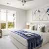 large bedroom with bright windows